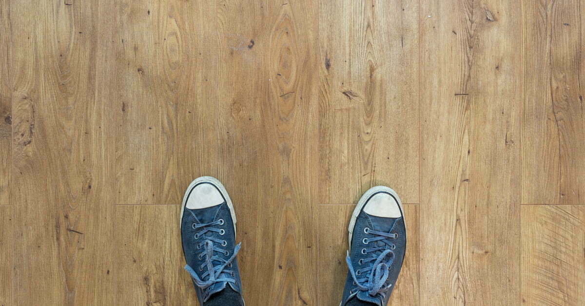Pair of blue shoes on a solid wood floor